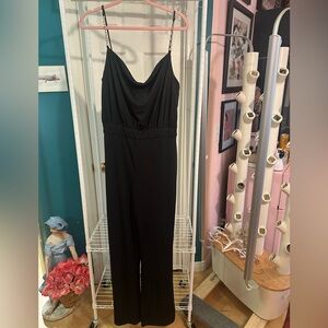 Jason Wu black jumpsuit with gold chain link jewel straps and cowl neck